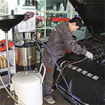 mechanic inspecting engine at m1cco