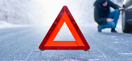 road safety, triangle warning, woman fixing car tire