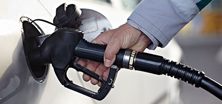 pumping gas, silver car, gas station