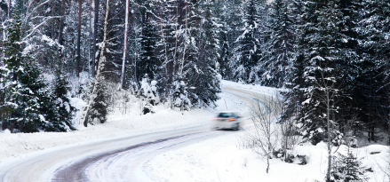 car running on the snowy road